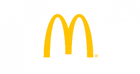 McDonald's golden arches logo on a brown background.